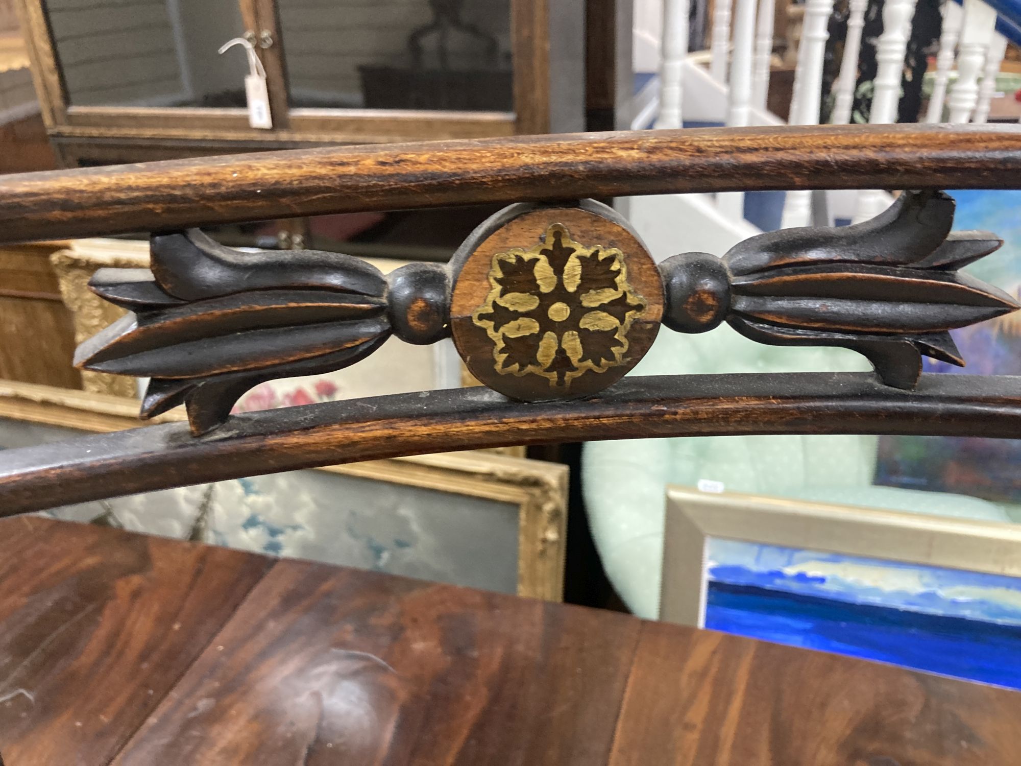 A set of five Regency brass inlaid simulated rosewood cane seated dining chairs